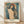Expressionist portrait of a faceless figure with a luminous halo, rendered in muted earth tones and deep blues, creating an ethereal and contemplative mood.