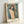 Modernist poster art depicting a simplified human form crowned with a radiant halo, using warm ochres and cool shadows for an introspective atmosphere.