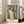 Expressionist wall art showing an enigmatic faceless figure enveloped in a luminous halo, painted in muted warm and cool tones with emotional intensity.