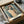 Expressionist bedroom wall art depicting an abstracted form with luminous halo in muted palette of ochre, blue, and grey, creating mood of quiet introspection.