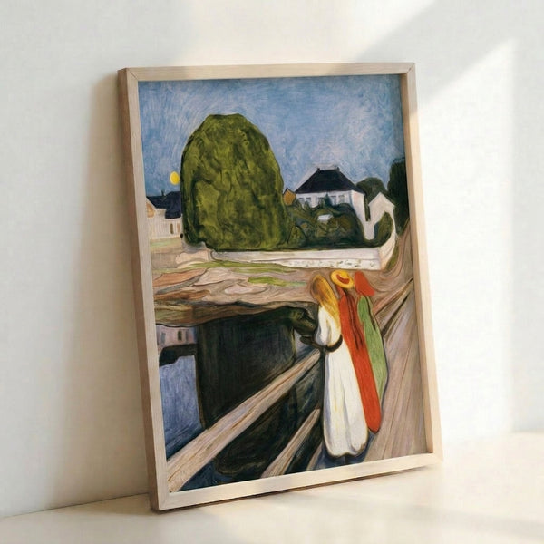 Wall art depicting Munch's iconic Girls On The Bridge composition with three figures in long dresses gazing toward water, executed in soft impressionist brushstrokes with a palette of muted greens, blues, and warm neutrals evoking quiet emotion.