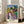 Wall art print in the style of Edvard Munch showing an indistinct figure emerging from muted blue and brown tones, conveying quiet solitude and melancholy.