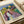 Framed contemporary art print in the expressionist tradition, presenting an ambiguous form in muted pigments of blue, gray, and ochre, creating an atmosphere of subtle unease.