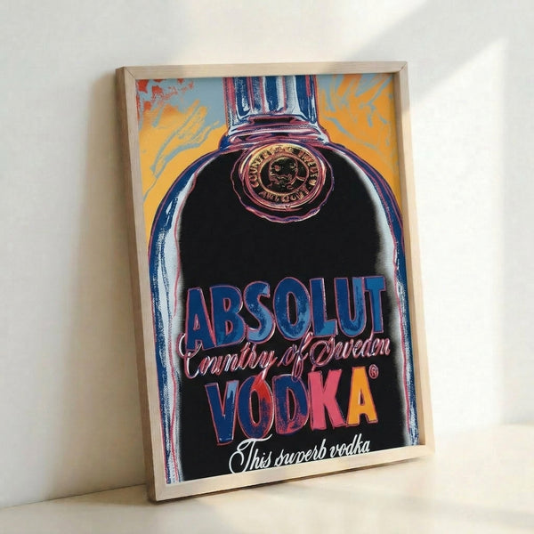 Colorful pop art poster showing an Absolut bottle design in striking neon tones, wall-mounted and framed with a bold, artistic interpretation characteristic of contemporary visual culture.