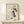 Abstract gold line drawing of hands at piano keys, contemporary poster with contemplative mood and off-white backdrop.