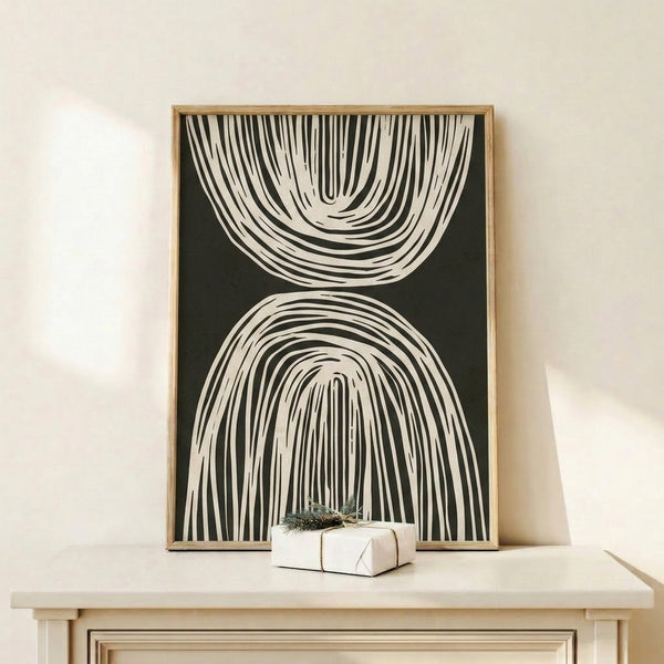 Framed minimalist art print with simple black contour lines suggesting flowing forms and zen-like balance on cream paper.