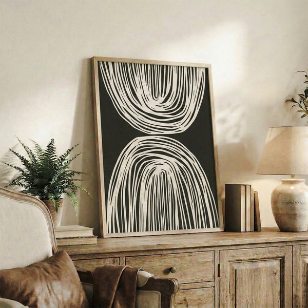 Monochromatic abstract drawing of interconnected arches and sweeping lines in black ink on ivory background.