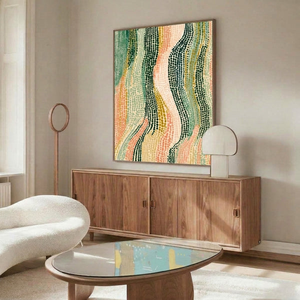 Minimalist abstract print in black, golden yellow, and muted coral stripes displayed framed on wall with contemporary meditative mood.