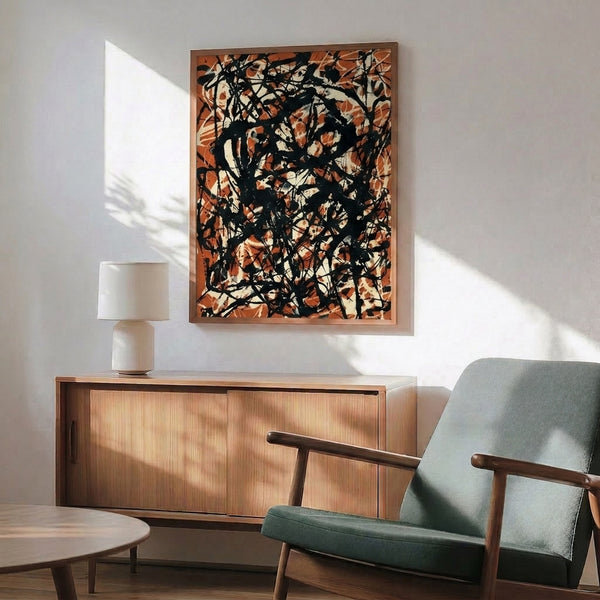 Modern abstract wall art featuring expressive black and rust drips on cream background, contemplative yet energetic framed print.