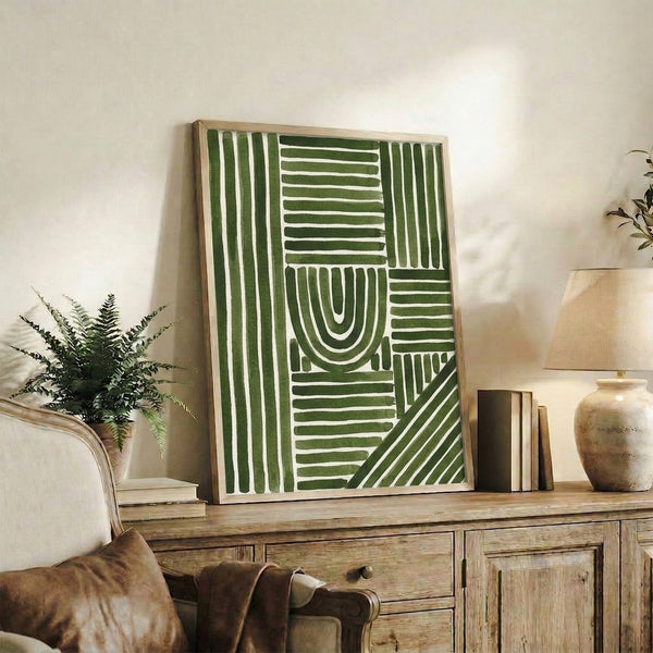 Framed abstract poster displaying gentle arching strokes in forest and light green hues on neutral background, capturing a meditative and balanced modernist vision.