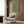 Minimalist wall art featuring layered geometric arch composition in calming forest green and cream palette, blending clean lines with understated movement.