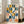 Structured geometric art print featuring navy, teal, and mustard stripes arranged in rhythmic checkerboard formation, capturing Bauhaus design principles in contemporary wall decor.
