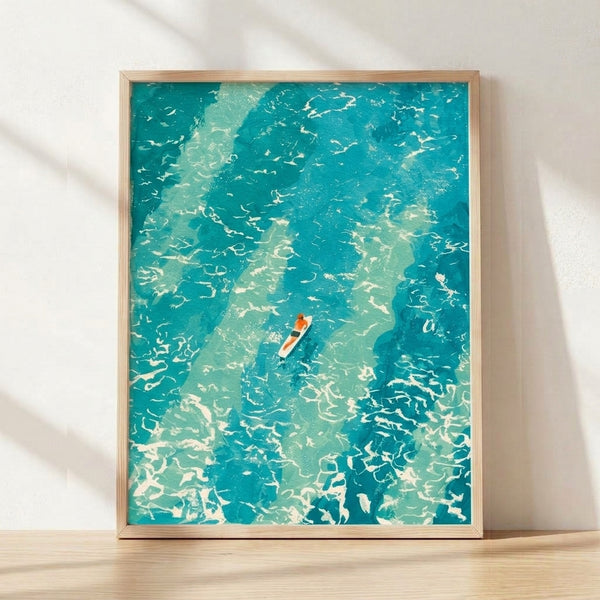 Minimalist watercolor poster of a lone surfer riding teal waves, featuring soft coral and cream tones in a peaceful coastal aesthetic displayed as framed wall art.
