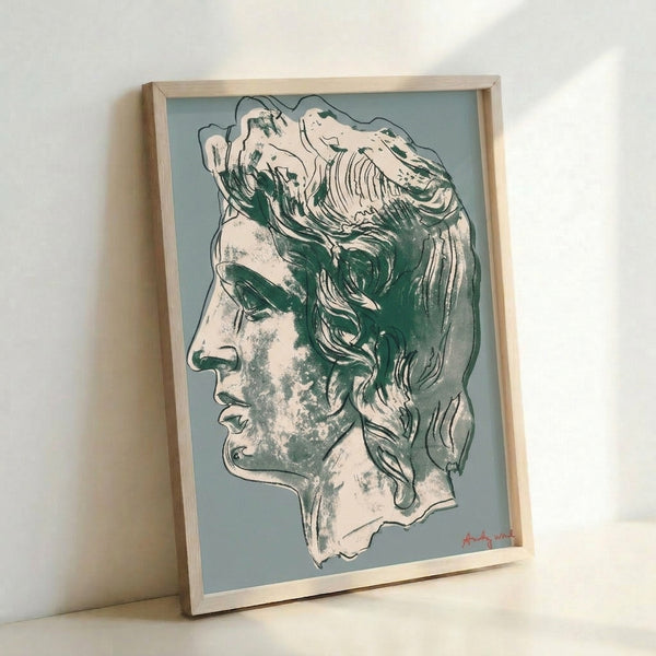 Grey and pink pop art style portrait poster hanging on a wall, depicting a historical figure with bold contemporary design.