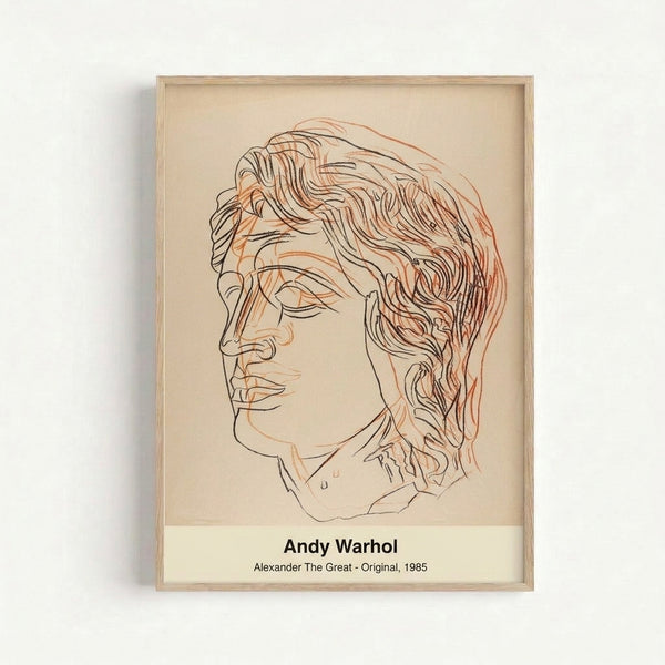 Iconic modern pop art print featuring a stylized male portrait in black and gold on cream background, showcasing vibrant contemporary artwork on a wall.