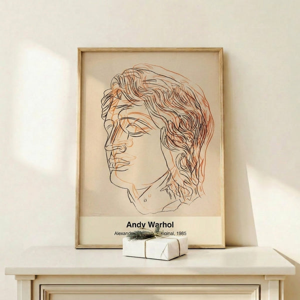 Framed modern pop art portrait print in black and gold tones against cream, capturing an iconic figure with vibrant color details and bold composition.