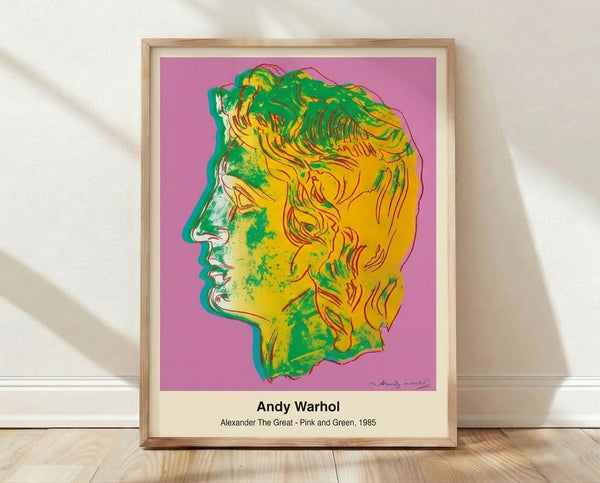 Bold pop art portrait of Alexander the Great in vibrant pink and green tones with black and white accents, framed on a wall as a modern art print.