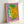 Modern wall art poster showing Alexander the Great rendered in luminous pink and green with characteristic pop art graphic treatment and bold simplicity.