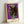 Bold iconic pop art print of Alexander the Great rendered in rich purple and gold against contrasting black and white, displayed as framed wall art.