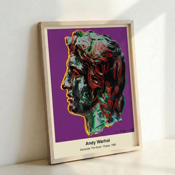 Bold iconic pop art print of Alexander the Great rendered in rich purple and gold against contrasting black and white, displayed as framed wall art.