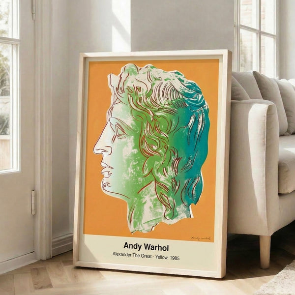 Framed pop art print of a man's portrait in brilliant yellow with magenta and black graphic elements, exemplifying modern pop art's bold, contemporary visual style.