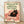 Vintage art nouveau style poster featuring a black cat lounging in a chair with a coffee cup and fishbowl, rendered in cream, forest green, red, and yellow tones with whimsical charm.