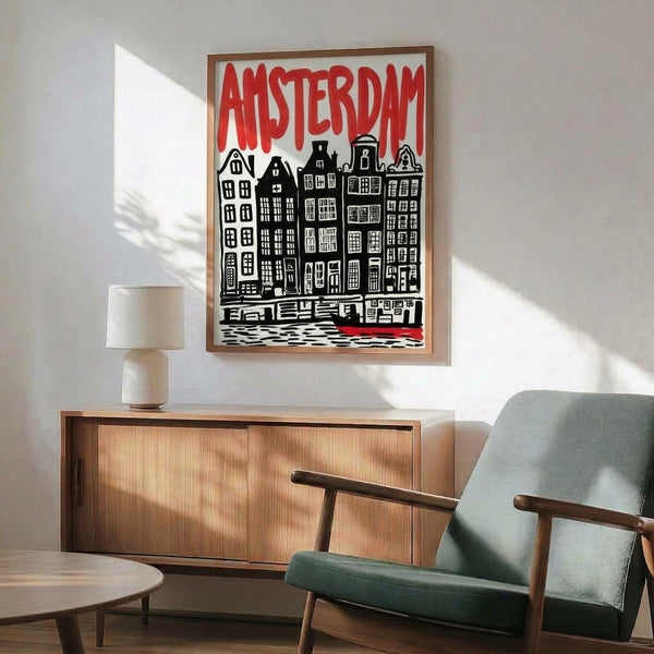 Framed print displaying a retro-inspired cityscape of Amsterdam canal houses rendered in striking red and black lines with minimalist graphic design, evoking classic travel poster aesthetics.