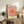 Retro pop art print of a sunset landscape in warm orange and peach gradients against a soft cream backdrop, exuding serene and meditative charm.
