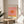Framed pop art sunset poster showcasing minimalist design in golden yellow, rose pink, and peach, evoking a warm and tranquil mood.