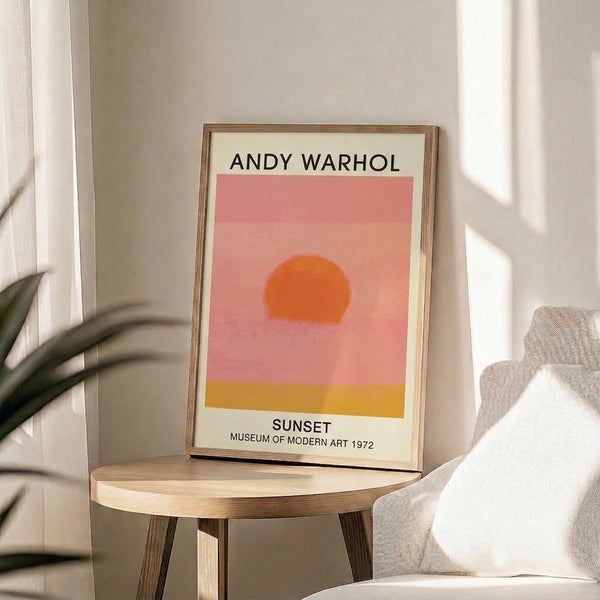 Framed pop art sunset poster showcasing minimalist design in golden yellow, rose pink, and peach, evoking a warm and tranquil mood.