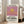Framed pop art landscape poster showing a stylized sun in warm golden yellow and pink gradients, creating a peaceful minimalist mood at dusk.