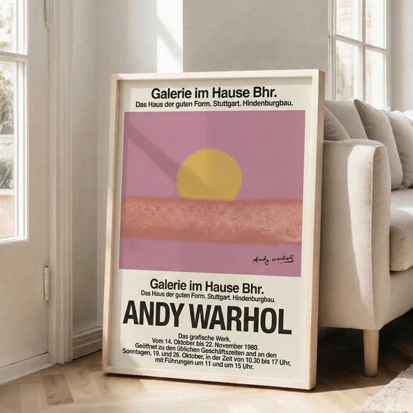 Framed pop art landscape poster showing a stylized sun in warm golden yellow and pink gradients, creating a peaceful minimalist mood at dusk.