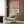 Contemporary pop art sunset poster with a prominent glowing orb in terracotta and cream against a serene horizon, minimalist wall art in modern style.