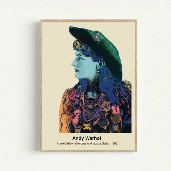 Framed pop art print featuring a striking portrait of Annie Oakley in bright primary colors and high-contrast style, evoking 1960s Americana and Western nostalgia.