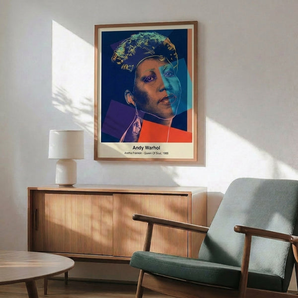 Vibrant framed pop art print showing Aretha Franklin in brilliant neon colors—hot pink, electric blue, and bright yellow—characteristic of Warhol's bold graphic style.