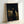 Old Master style framed portrait of an introspective figure posed with a classical sculpture, painted in warm browns and creams with atmospheric depth.