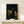 Rembrandt masterpiece poster showing a man in flowing robes contemplating an ancient marble head, rich browns and golds creating a moody intellectual atmosphere.