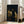 Framed Renaissance-style portrait of a robed figure pensively studying a classical sculpture, painted with warm ochres and deep shadow tones.