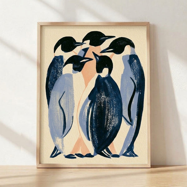 Art Deco framed poster featuring huddled emperor penguins in cream, navy, and peach tones with gold accents, capturing elegant minimalist sophistication.