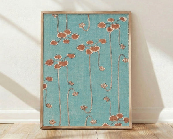 Art Nouveau botanical poster with stylized clover and leaf motifs in turquoise, terracotta, and cream tones, framed on a wall.