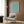 Zen garden botanical poster featuring graceful clover and leaf forms in muted turquoise and earthy terracotta hues.