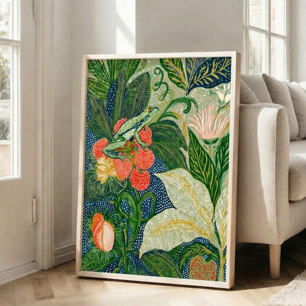 Japandi-inspired framed poster with a naturalistic frog composition nestled among ornamental flowers, leaves, and berries in warm coral and deep green hues with gold accents.