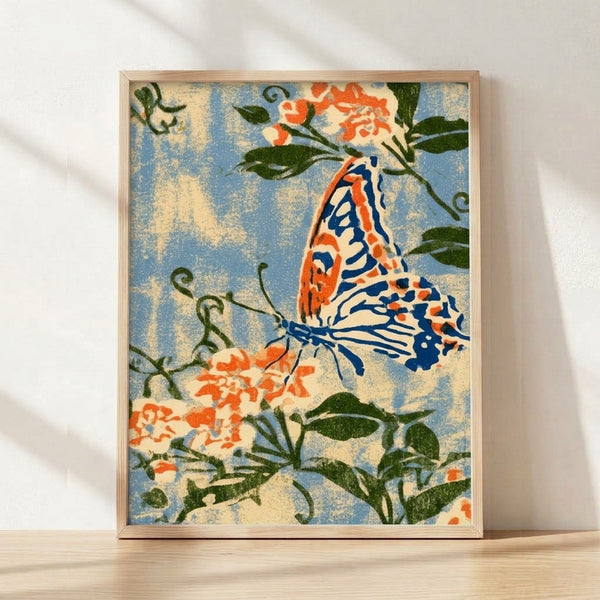 Art Nouveau framed poster featuring an elegant monarch butterfly with intricate wings in coral orange and navy, surrounded by delicate flowering plants and dark green foliage on a cream background.
