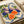 Vintage-style botanical poster in Art Nouveau tradition featuring figs with graceful plant forms in cream, purple, and blue tones, displaying a luxurious naturalistic aesthetic on display.