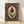 Framed Art Nouveau poster featuring an ornamental deep red tulip with forest green leaves and gold accents on cream background, evoking elegant Ottoman manuscript illumination.