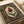 Vintage-inspired poster presenting an intricately decorated tulip flower with luxurious gold embellishments and deep red petals, forest green leaves, on cream, reflecting Ottoman manuscript elegance.