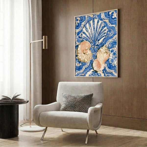 Whimsical watercolor artwork combining nature-inspired seashell and botanical motifs in rich cobalt blue with soft pink and gold embellishments, framed on wall.