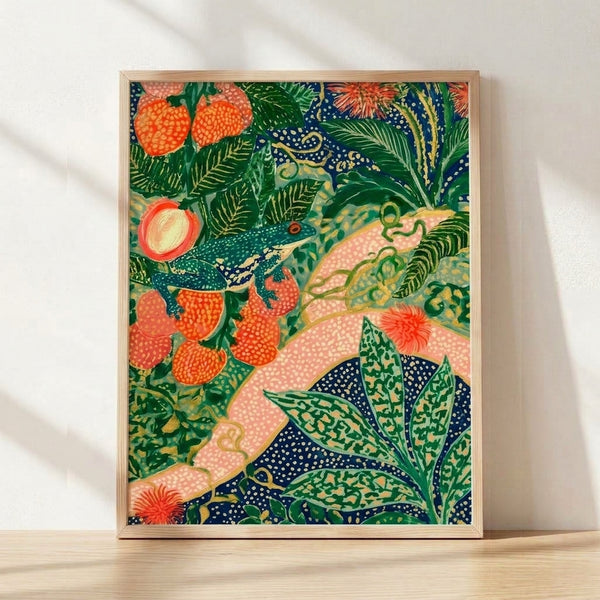 Art Nouveau botanical print featuring a whimsical frog among strawberry plants, ferns, and delicate flowers in coral, forest green, and gold tones on cream background, framed on wall.