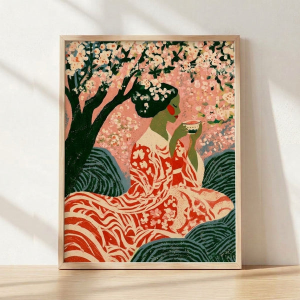 Framed art print of a serene woman in traditional dress seated beneath cherry blossoms, rendered in soft dusty pink, forest green, and cream tones with romantic Art Nouveau styling.