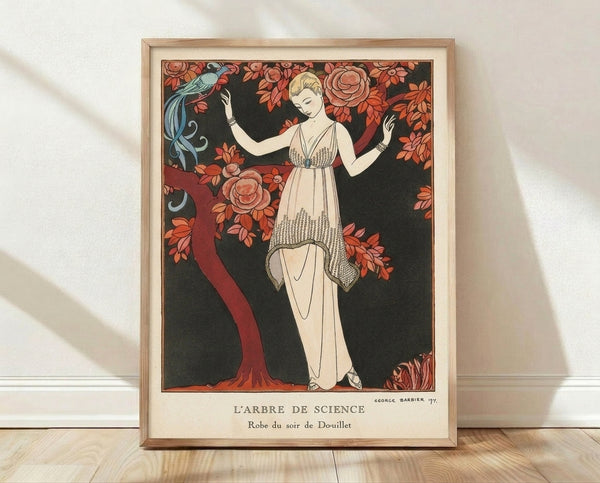 Art Nouveau framed poster featuring an elegant woman in a flowing coral dress beside a stylized tree with delicate flowers and a perched bird, rendered in cream, black, and rust tones.